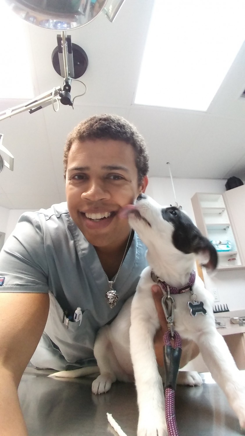 Jonathon - Veterinary Assistant being licked by dog